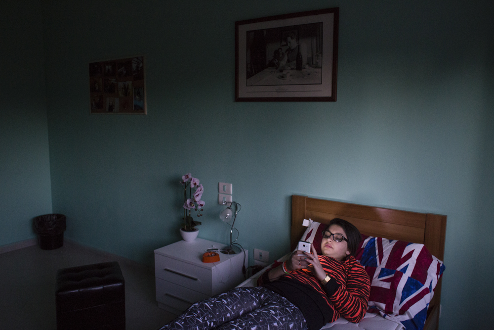03/28/2015 - Rome (Italy). Jessica is 17 years old, relaxes on her bed in her bedroom
